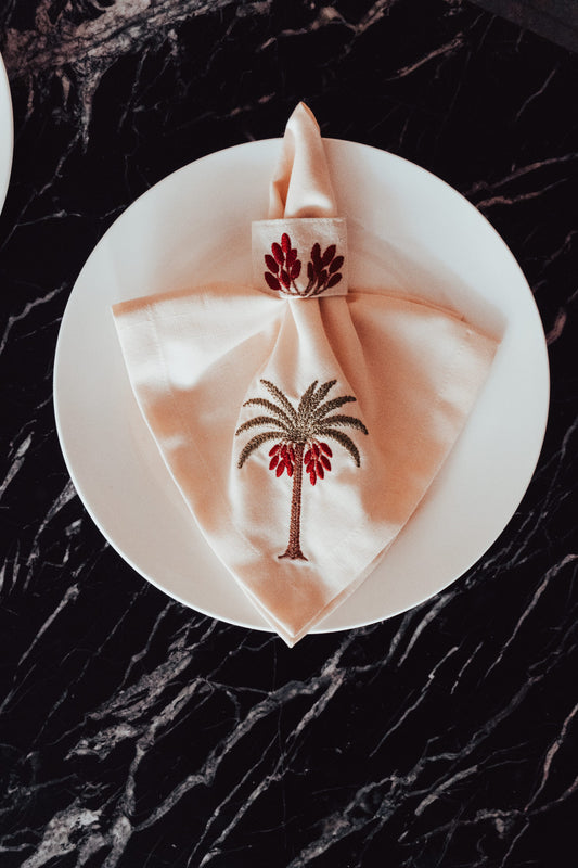 Linen Palmette Napkin & Ring Set – Mixed Linen & Cotton Canvas Elegant linen napkin embroidered with palm and date motifs, paired with a matching cotton canvas ring — a refined touch for sophisticated table settings.